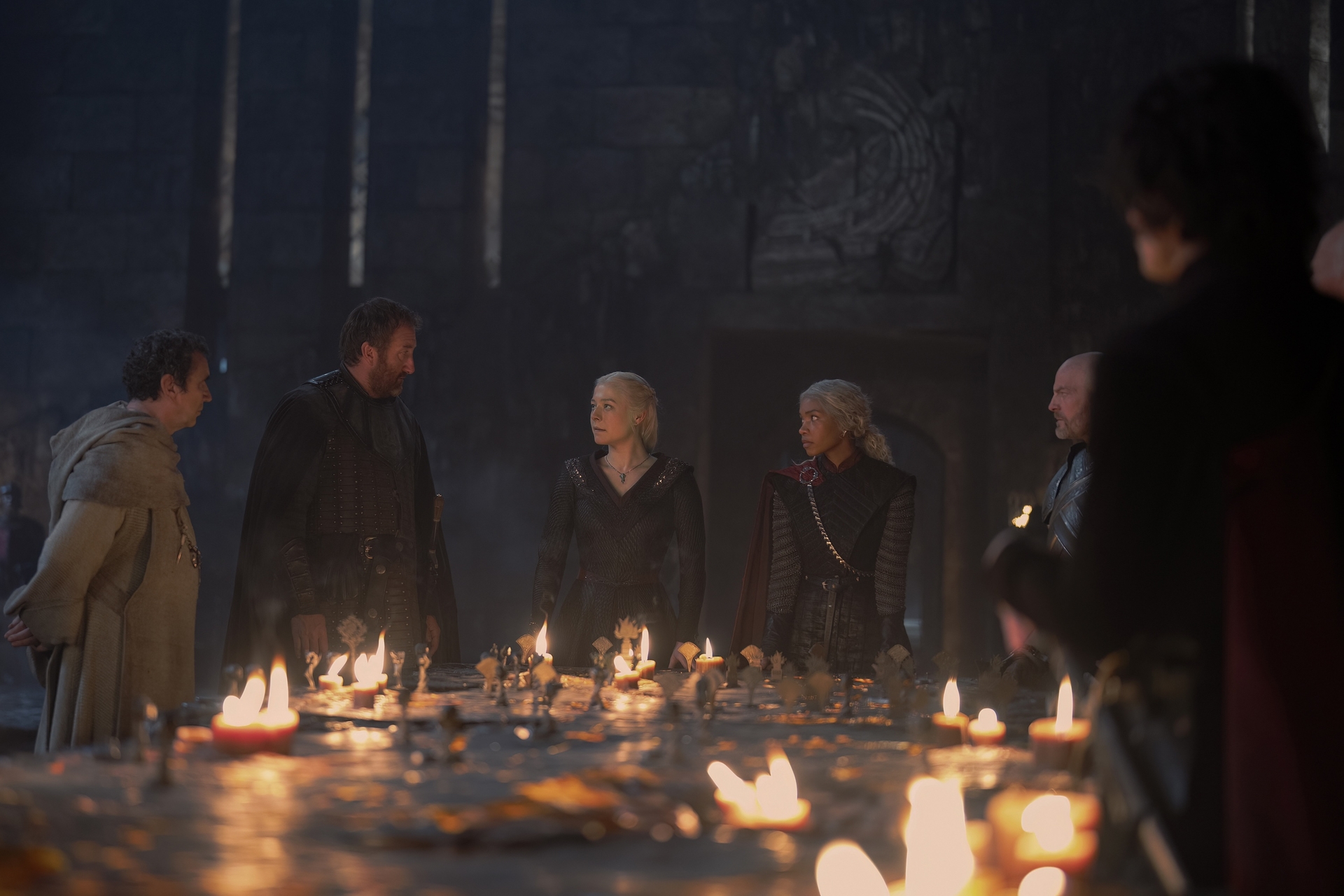 Phil Daniels, Jamie Kenna, Emma D'Arcy, Bethany Antonia, Max Wrottesley, and Harry Collett in George R R Martin and Ryan Condal's HBO action adventure fantasy drama television adaptation, House of the Dragon, Season 2 Episode 3