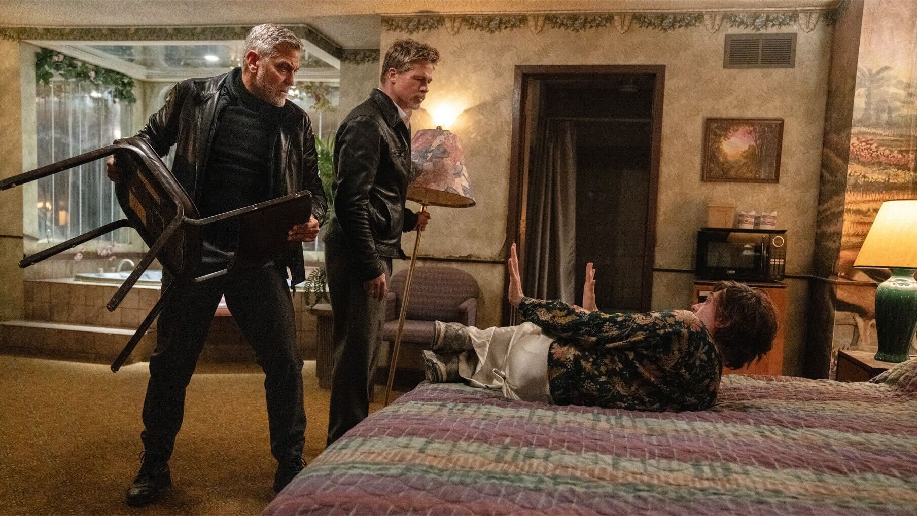 George Clooney, Brad Pitt, and Austin Abrams in Jon Watts's action comedy crime streaming film, Wolfs