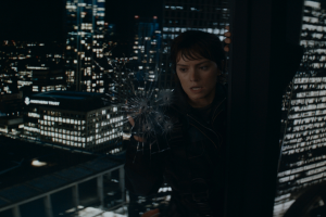 Daisy Ridley attempting to break through a window in Cleaner